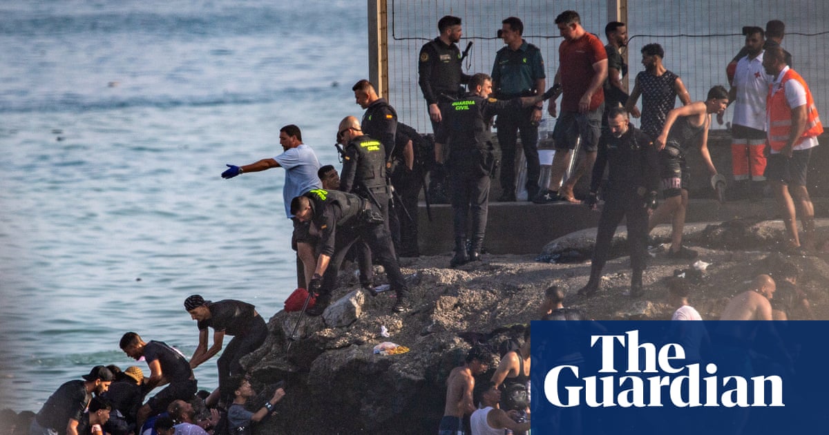 At least 57 people die as tens of thousands cross to Spanish enclave of Ceuta from Morocco