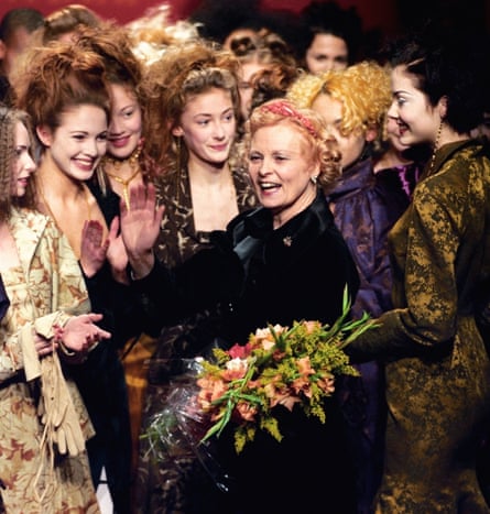 Vivienne Westwood is applauded by models wearing her autumn/winter 1997-98 collection at London fashion week. The late designer was inspired by 18th-century fashion.