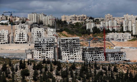 Israeli construction cranes and excavators at a building site of the Jewish settlement of Neve Yaakov, in the northern area of East Jerusalem.