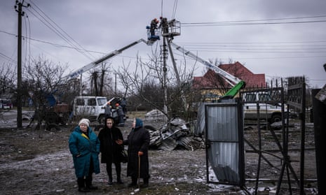 Women talk near a missile landed in the village of Hlevakha, on January 26, 2023 in Kyiv Region, Ukraine. Russia launched a wave of missiles at Ukraine on Thursday, a day after Germany and the US pledged tanks to aid Kyiv's fight against the invasion.