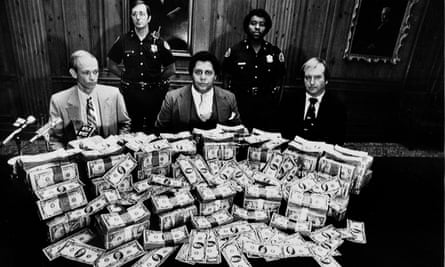 Maynard JacksonAtlanta Mayor Maynard Jackson, center, is flanked by security guards in his office as he poses with $100,000 reward money offered for clues to the deaths of 17 Atlanta children, Feb. 21, 1981.(AP Photo)
