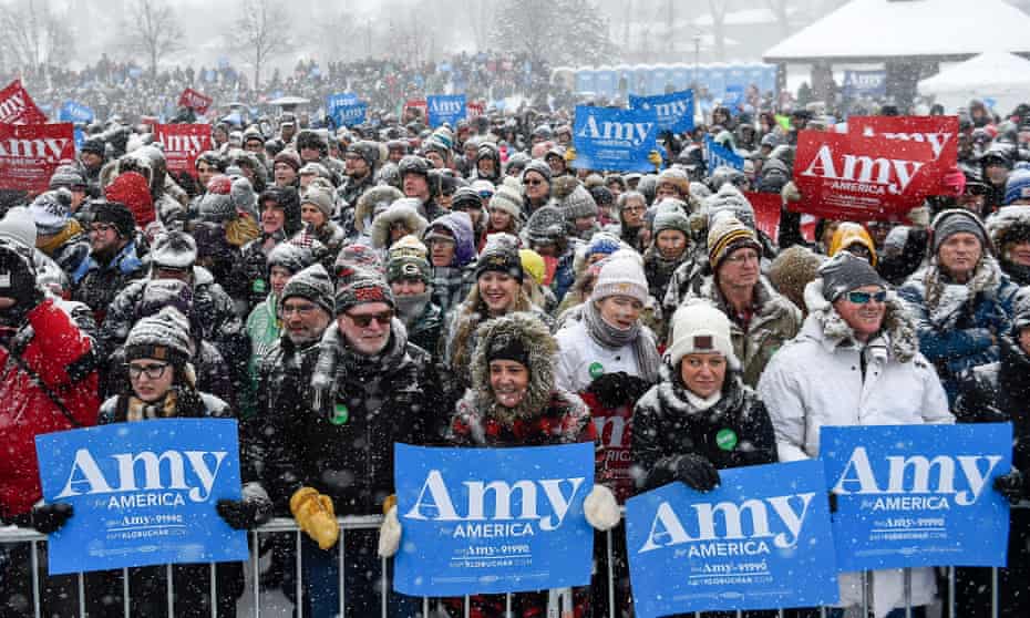 Supporters wait in a snowfall to see Democratic Senator of Minnesota Amy Klobuchar announce that she is running for US president in Minneapolis on Sunday.