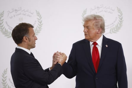 Trump and Macron clasping hands
