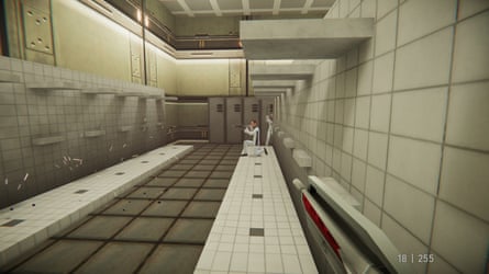 A public bathroom. Enemies are there, the player is carrying a gun.