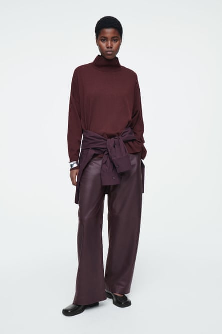 Model wearing burgundy jumper and trousers