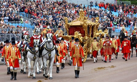 The gold state coach passes in front of Buckingham Palace during the platinum jubilee pageant for Queen Elizabeth II