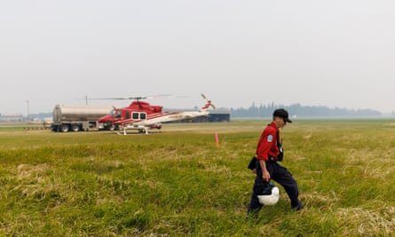 Wildfire ignitions specialist Mike Morrow heads out for a recon flight from the operations centre in Vanderhoof, British Columbia, Canada.