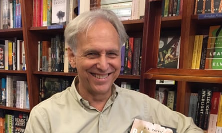 Mark Rubbo in front of a bookshelf in Readings