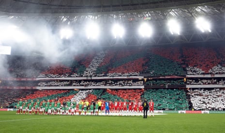 The teams line up before kick-off.