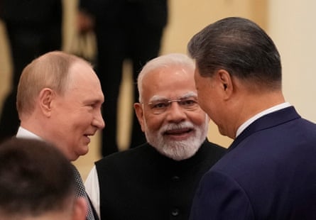 Putin, Modi and Xi speak to one another.