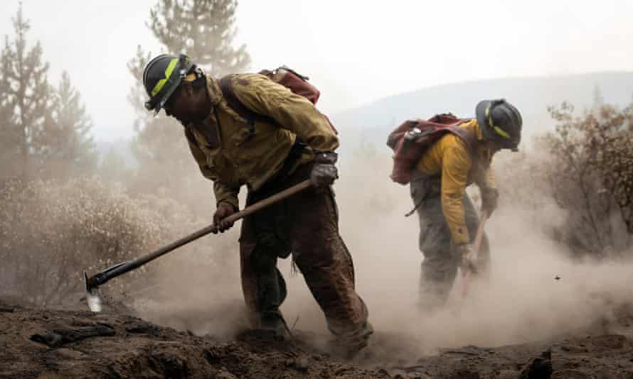Firefighters from New Mexico work amidst heavy ash and dust to help contain the Bootleg fire near Silver Lake, Oregon.