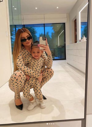 Kylie Jenner and daughter Stormi wearing matching Serre catsuits.