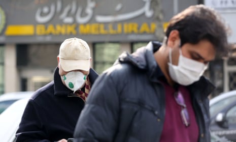 People in Tehran wear masks after four fatalities.