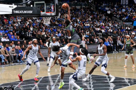 Anthony Edwards of the Minnesota Timberwolves dunks the ball during a game against the Orlando Magic.