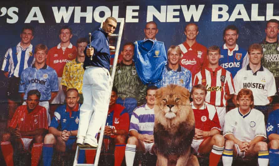 Wimbledon’s Vinnie Jones nails a Wimbledon shirt to his image on a billboard promoting the first Premier League season