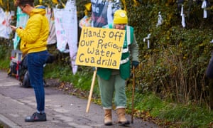 An anti-fracking protester holding a sign