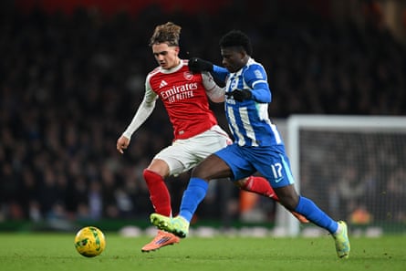 Max Dowman is challenged by Carlos Baleba of Brighton