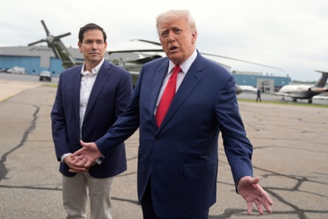 President Donald Trump, right, speaks with reporters as Secretary of State Marco Rubio listens upon arriving at Morristown Municipal Airport in Morristown, N.J., en route to Camp David, Md., Sunday, 8 June, 2025.