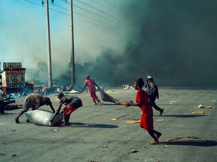 Market burning during a riot in Port-au-Prince, Haiti, 1999
