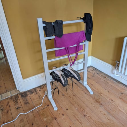 A Dunelm Ladder heated airer in a yellow room with a wooden floor
