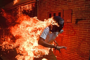 Caracas, Venezuela
This photograph of a demonstrator catching fire during clashes with riot police during a protest against Venezuelan President Nicolas Maduro in Caracas by  photographer Ronaldo Schemidt won the World Press Photo of the Year 2018 award.
