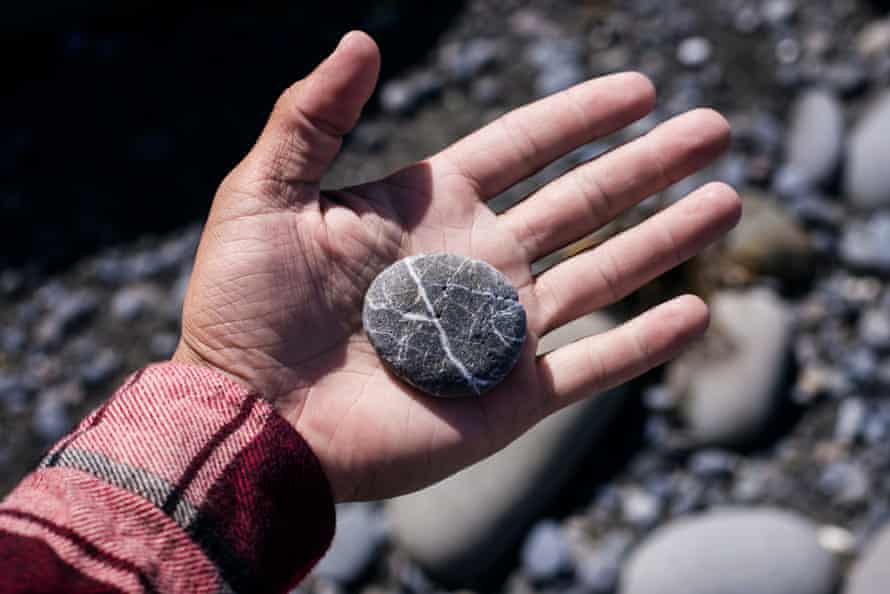 Hand holding a pebble