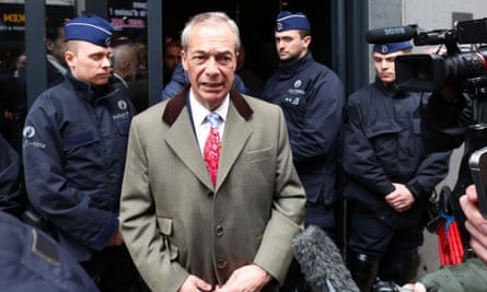 Nigel Farage speaks to the media outside the conference venue.