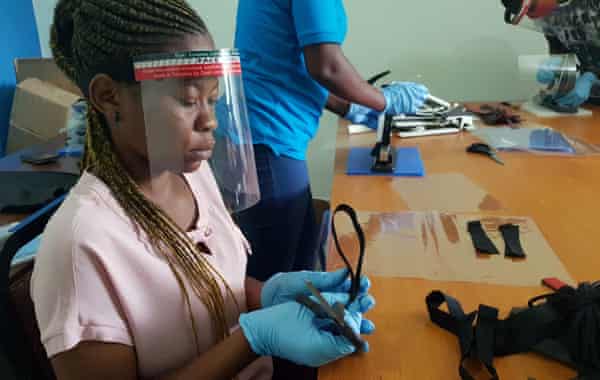 Workers prepare anti-Covid face shields from recycled plastics at a workshop in Dar es Salaam, Tanzania.