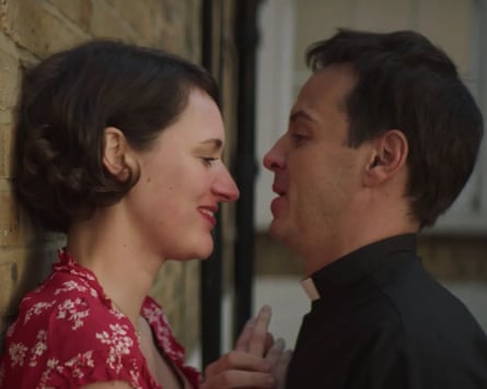 Woman stands against wall with priest inches from her face