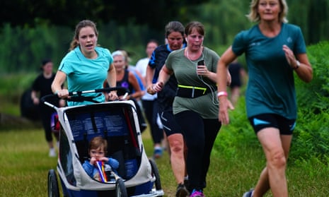 Runners taking part in the parkrun at Bushy Park in London