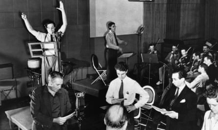 Orson Welles rehearsing a radio broadcast of The War of the Worlds in 1938