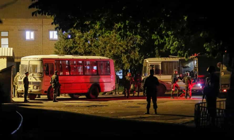 Buses carrying Ukrainian soldiers evacuated from the besieged Azovstal steel mill in Mariupol arrive under escort of the pro-Russian military in Novoazovsk.