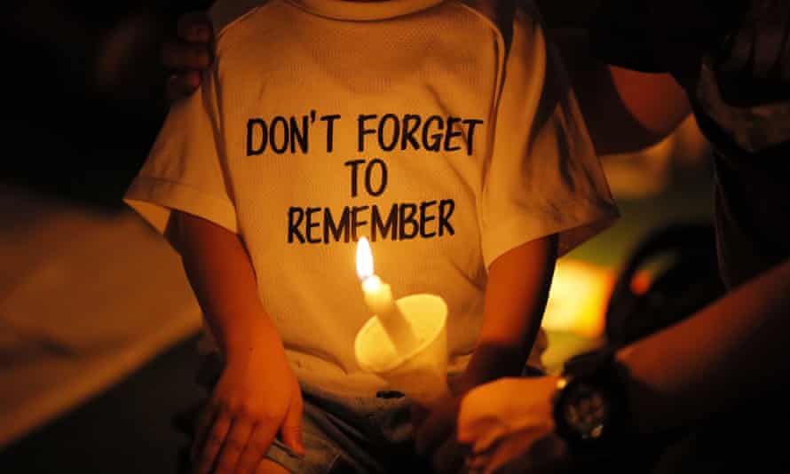 a child in hong kong wears a 'dont forget to remember' t-shirt in 2019