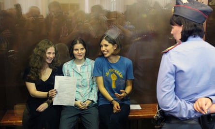 Mariya Alyokhina (left) with fellow Pussy Riot members Yekaterina Samutsevich and Nadezhda Tolokonnikova at their sentencing in Moscow, 17 August 2012.
