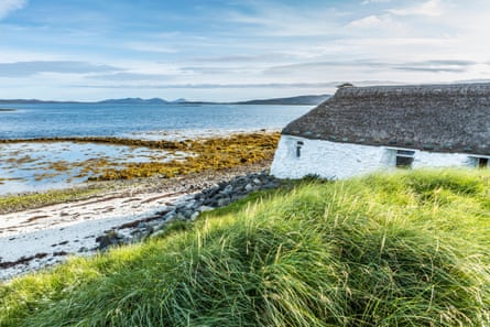 old white building with views over the sea