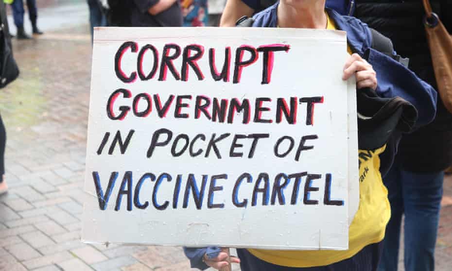 A sign at an anti-vaccine protest that reads: "Corrupt government in pocket of vaccine cartel"