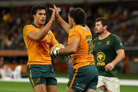 Ben Donaldson celebrates with Joseph-Aukuso Suaalii after scoring a try against South Africa.