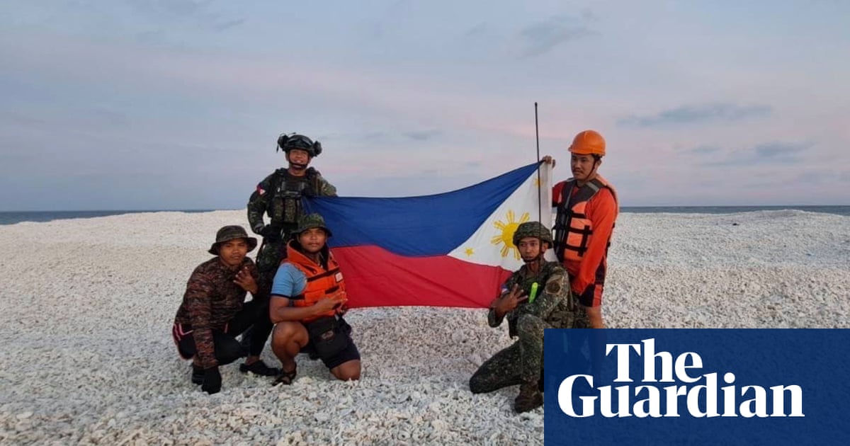 China and Philippines display competing flags on disputed South China Sea sandbank