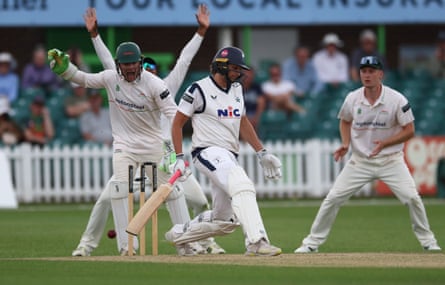 Ben Cox sees the ball rebound on to the stumps as Jack White remains in his ground during Day 3 of the County Championship One match between Leicestershire and Yorkshire