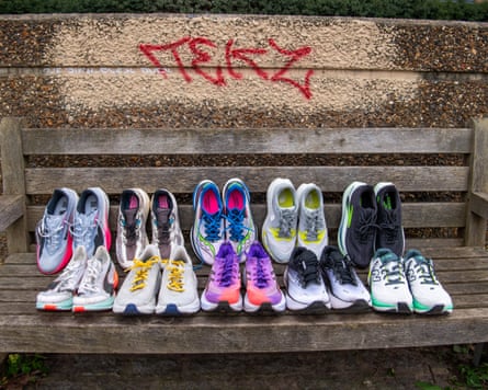 10 pairs of running shoes on a bench