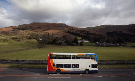 A rural bus service makes its way through the Lake District in Grasmere