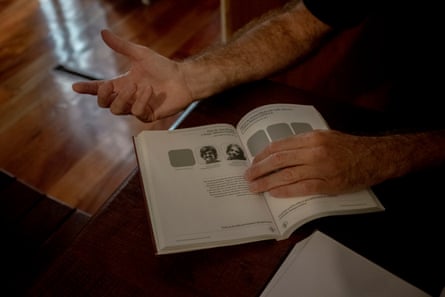 An open book with some headshots in it