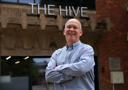 Mark Webb smiling with arms folded in Grimsby town centre.