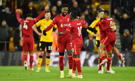 Liverpool’s goalscorer Divock Origi celebrates with Sadio Mane after the final whistle.