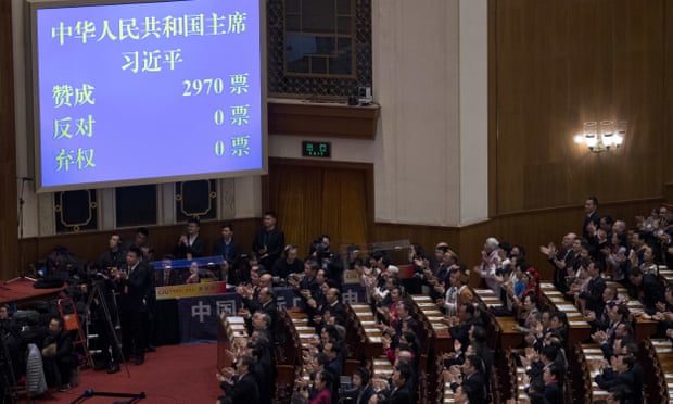 Delegates applaud as a screen showing 2,970 votes for the reelection of Chinese president Xi Jinping during a plenary session of the people’s congress in Beijing on Saturday.