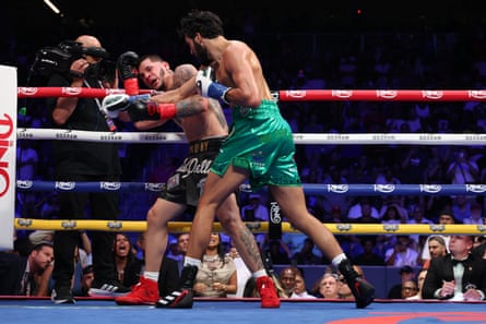 Hamzah Sheeraz, right, lands a punch on Edgar Berlanga, left, during their super middleweight fight at Louis Armstrong Stadium on Saturday night.