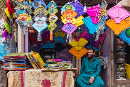 A kite trader in a backstreet in Ahmedabad sells colourful kites