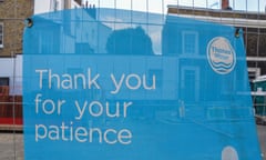 Close-up of a Thames Water banner on fencing by some waterworks saying 'Thank you for your patience'