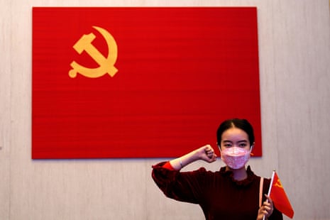 A woman poses for a picture during an event marking the 100th anniversary of the founding of the Chinese Communist party of China in Shanghai.
