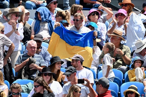 A fan holds a Ukraine flag